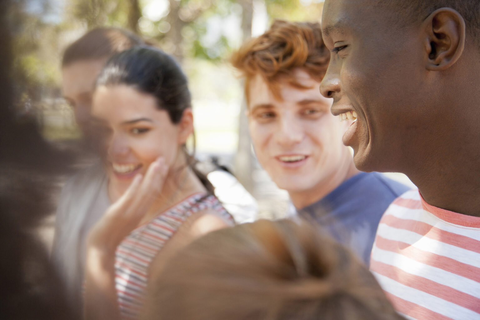 Group of students laughing outdoors